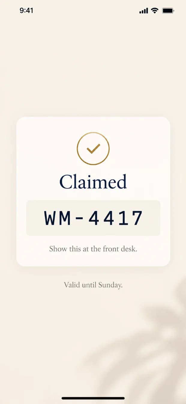 The claimed offer on a phone: a code to show at the front desk and the day it runs until